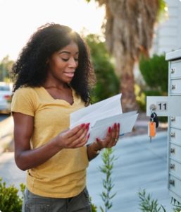 woman opening mail is a good way to generate leads
